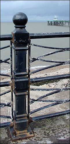 Railing post, Clevedon, with pier; August 23rd, 2004