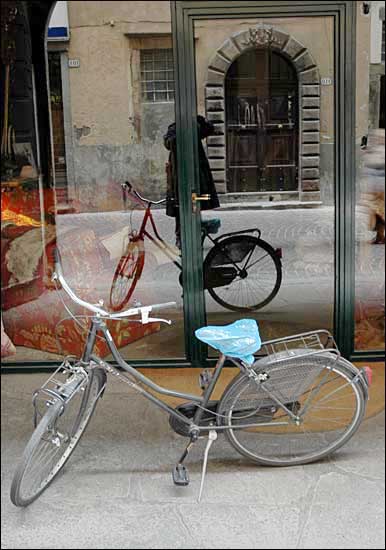 Bike in a window with partially hidden photographer, February 11th, 2005