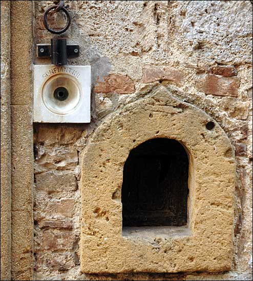 Door bell and niche, San Gimignano, Italy; February 8th, 2005